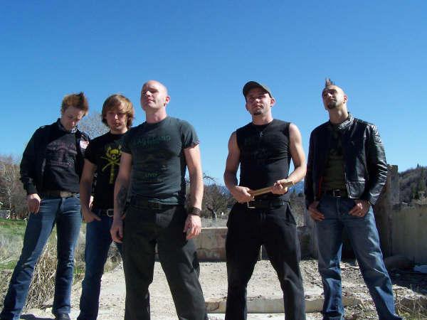 Irish band Morello band Photo in a desert with a blue sky behind them