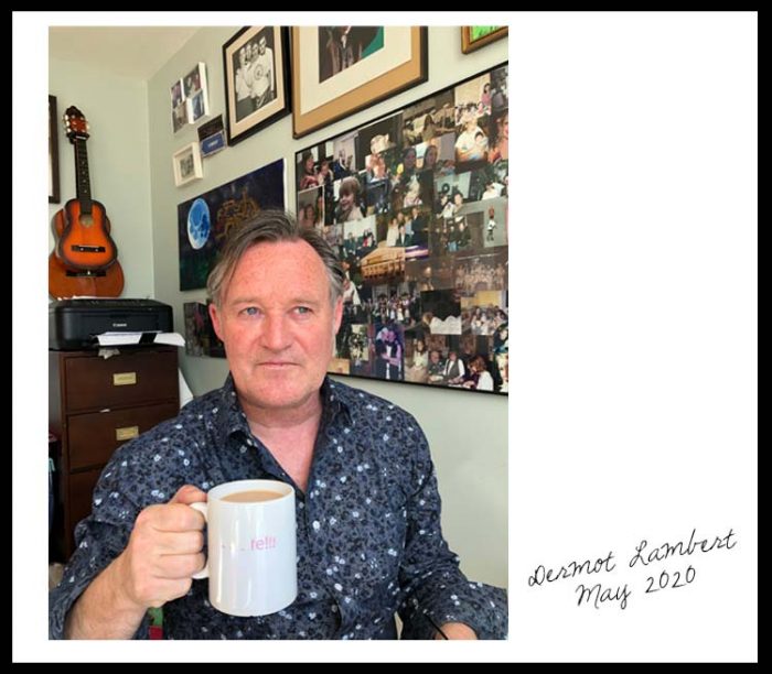 Dermot Lambert with a cup of tea in his home office