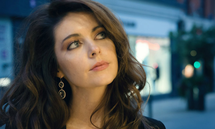 Singer FiCat promo shot, looking upwards to the right